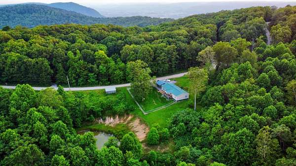 10.7 Acres of Land with Home for Sale in Spring City, Tennessee