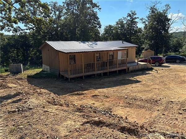 21.8 Acres of Land with Home for Sale in Stover, Missouri