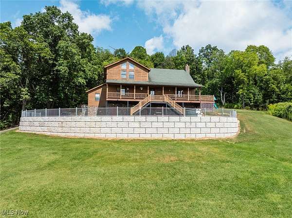 12.1 Acres of Land with Home for Auction in Coshocton, Ohio