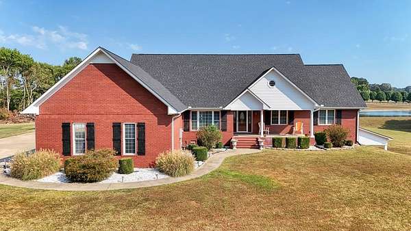 9.8 Acres of Land with Home for Sale in Gleason, Tennessee