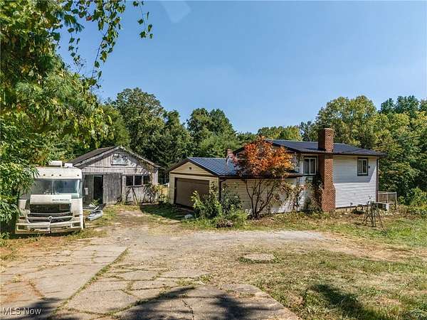 10.7 Acres of Land with Home for Auction in East Sparta, Ohio