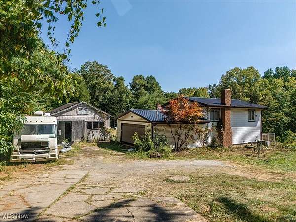 10.7 Acres of Land with Home for Auction in East Sparta, Ohio