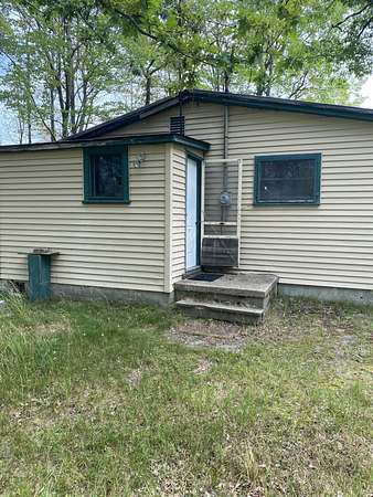 5 Acres of Residential Land with Home for Sale in Free Soil, Michigan
