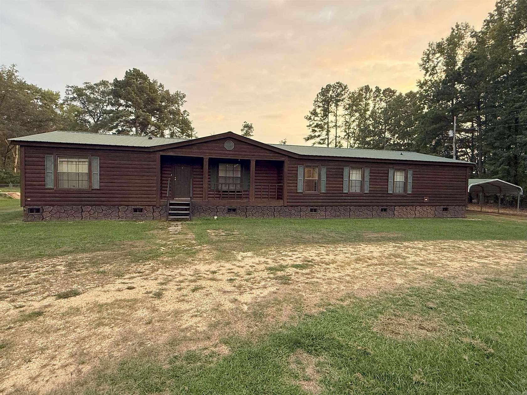 10.4 Acres of Land with Home for Sale in New Edinburg, Arkansas