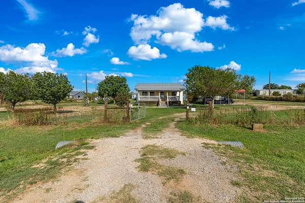 1.62 Acres of Residential Land with Home for Sale in Devine, Texas