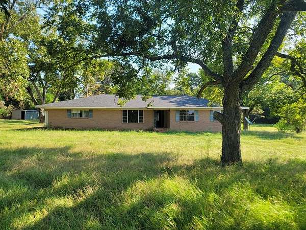 5.19 Acres of Residential Land with Home for Sale in Elkhart, Texas
