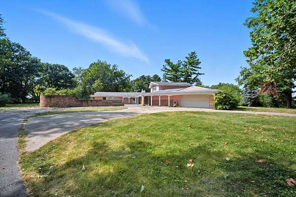 6.35 Acres of Residential Land with Home for Sale in Carlisle, Iowa