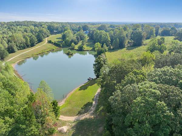 11.3 Acres of Land with Home for Sale in Holladay, Tennessee