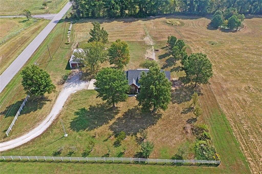 14.3 Acres of Land with Home for Sale in Harrisonville, Missouri