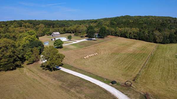 80.9 Acres of Land with Home for Sale in Collins, Missouri