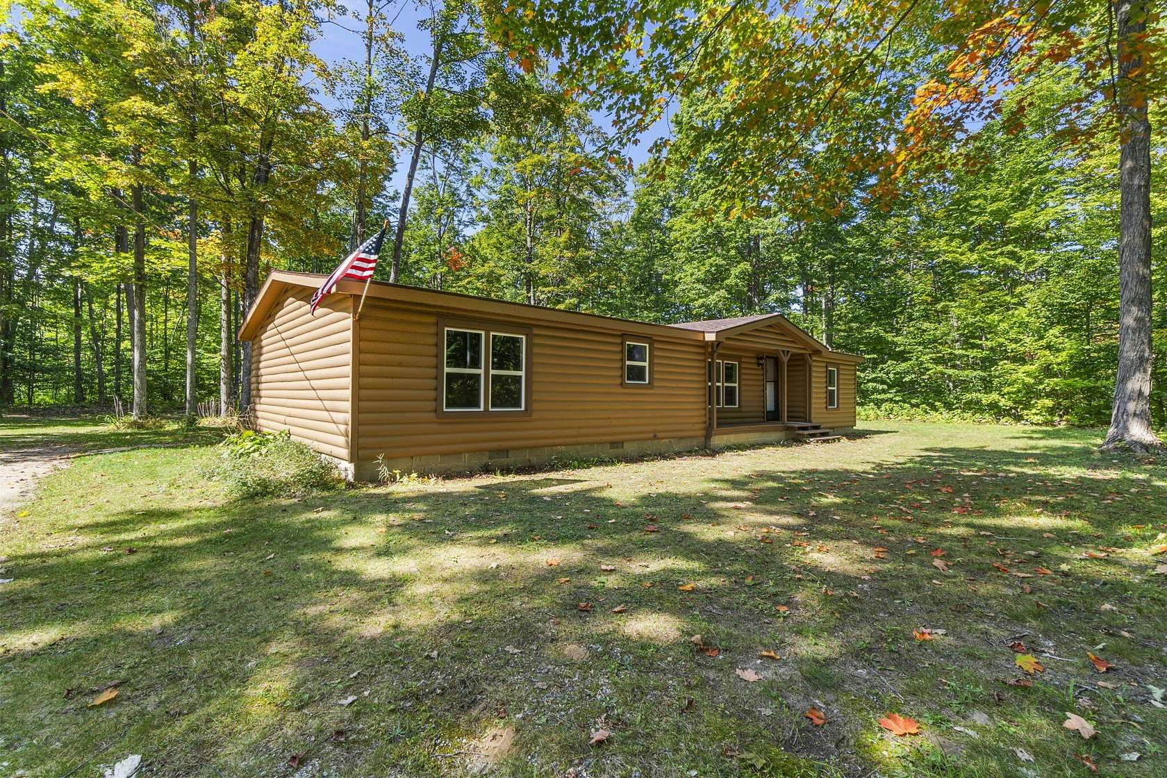 14.7 Acres of Recreational Land with Home for Sale in Mancelona, Michigan