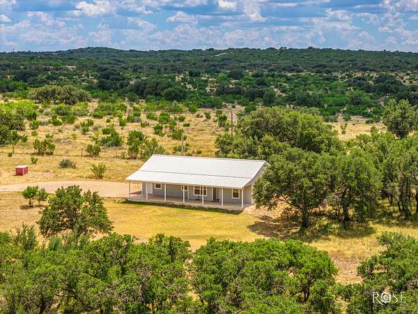 9.59 Acres of Land with Home for Sale in Mertzon, Texas