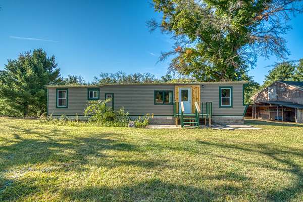 1.52 Acres of Residential Land with Home for Sale in Howard City, Michigan