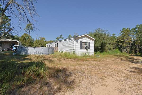 5 Acres of Residential Land with Home for Sale in Freeport, Florida