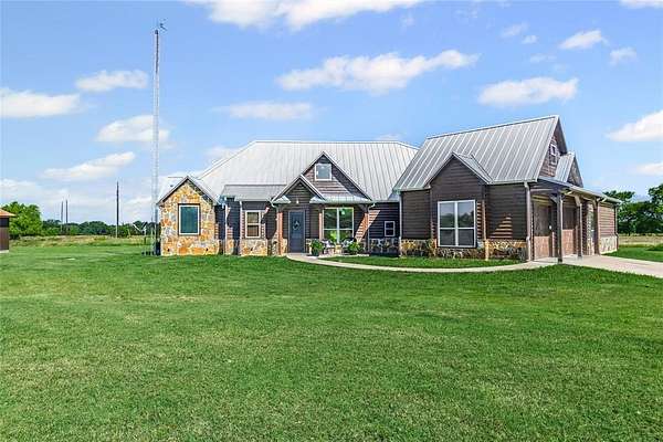 9 Acres of Residential Land with Home for Sale in Cumby, Texas