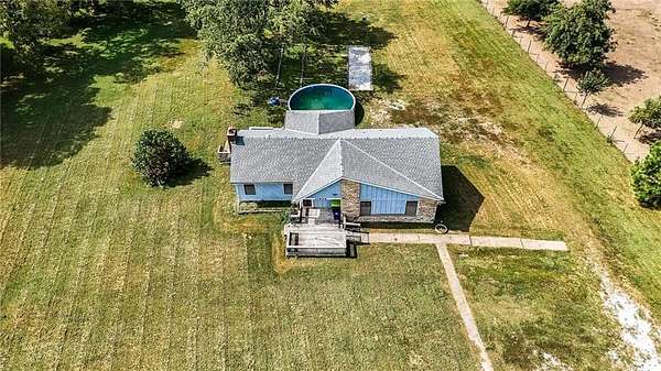 3.3 Acres of Residential Land with Home for Sale in Belton, Missouri