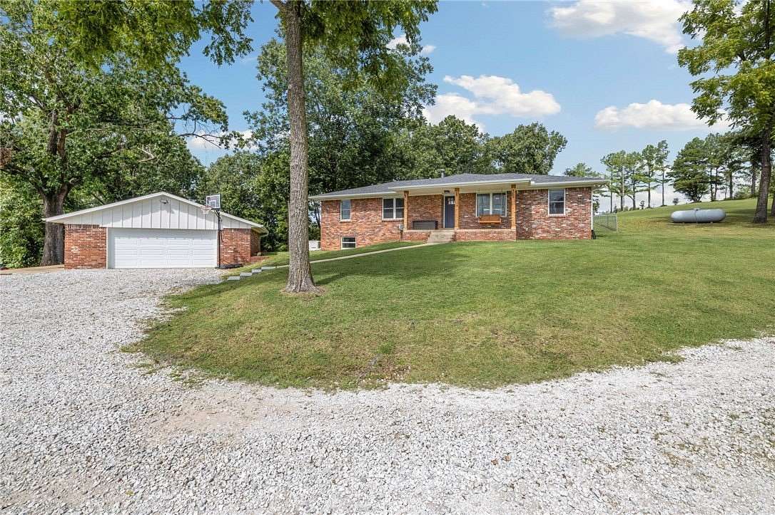21.3 Acres of Recreational Land with Home for Sale in Lowell, Arkansas