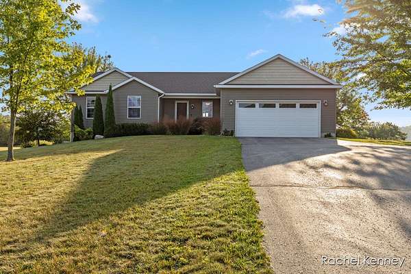 1.5 Acres of Residential Land with Home for Sale in Lowell, Michigan