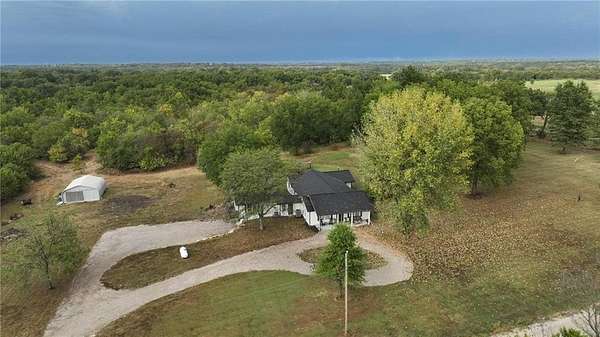 30.3 Acres of Agricultural Land with Home for Sale in Adrian, Missouri