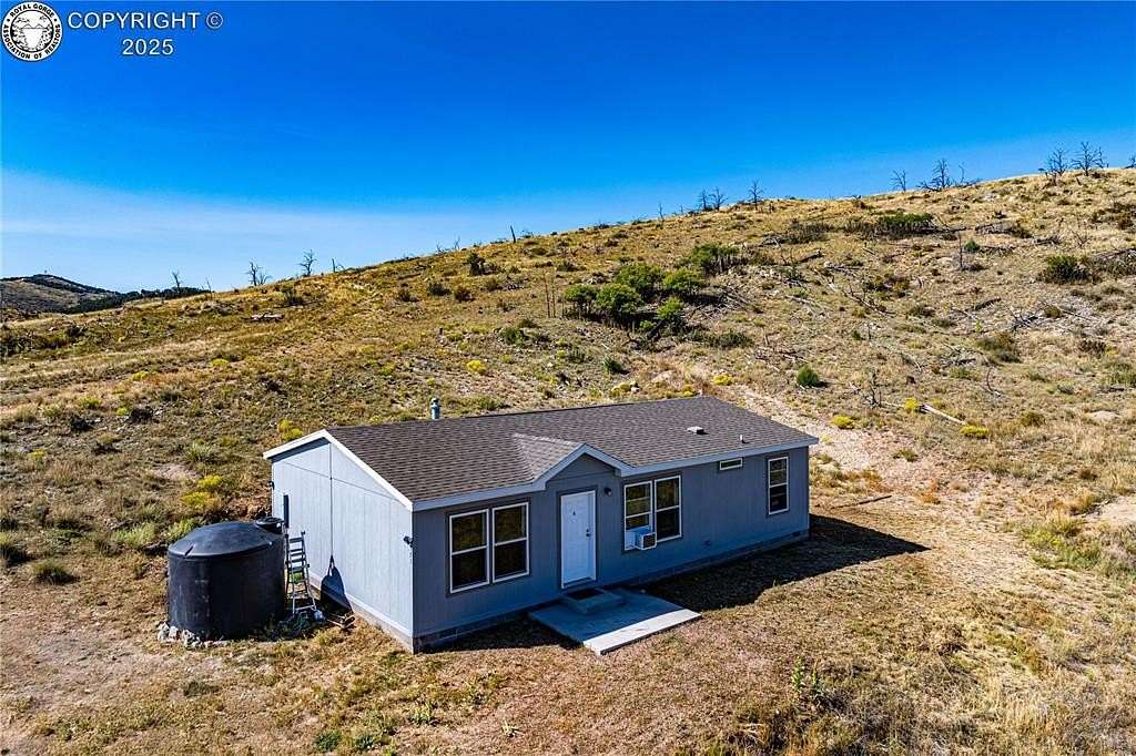 5 Acres of Land with Home for Sale in Cotopaxi, Colorado