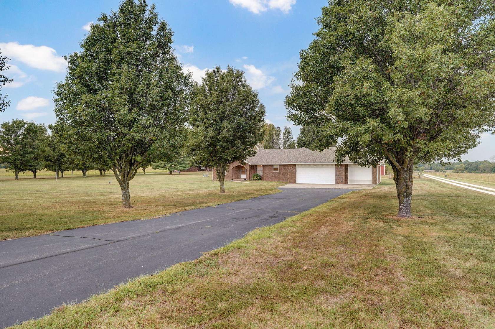 5 Acres of Residential Land with Home for Sale in Strafford, Missouri