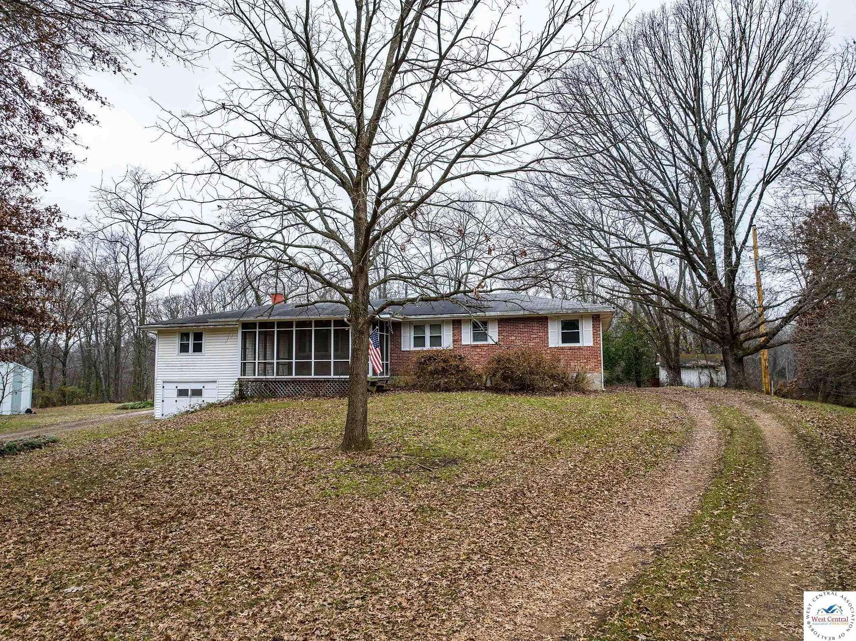 10.6 Acres of Land with Home for Auction in Clinton, Missouri