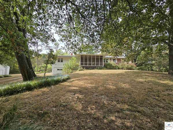 10.6 Acres of Land with Home for Auction in Clinton, Missouri