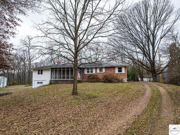 10.6 Acres of Land with Home for Auction in Clinton, Missouri