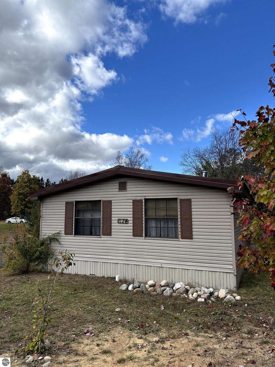 2.7 Acres of Residential Land with Home for Sale in Bellaire, Michigan