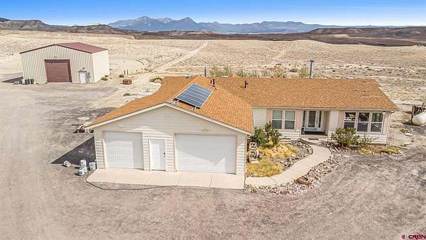 33.9 Acres of Agricultural Land with Home for Sale in Hotchkiss, Colorado