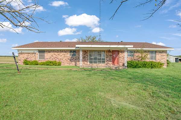 1.5 Acres of Land with Home for Auction in Cooper, Texas