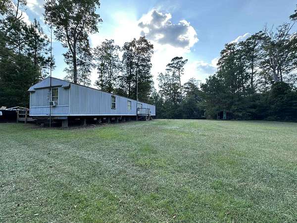 6.33 Acres of Residential Land with Home for Sale in Spurger, Texas