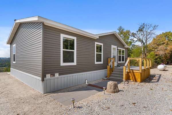 8 Acres of Residential Land with Home for Sale in Mountain Home, Arkansas