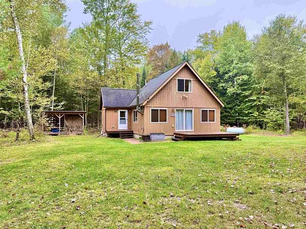 10 Acres of Recreational Land with Home for Sale in Rapid River, Michigan