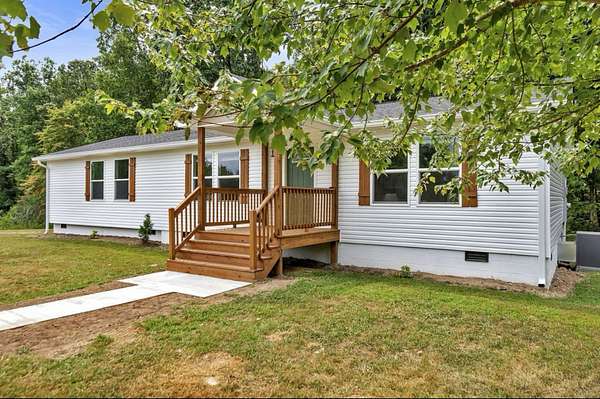 5 Acres of Residential Land with Home for Sale in Bon Aqua, Tennessee