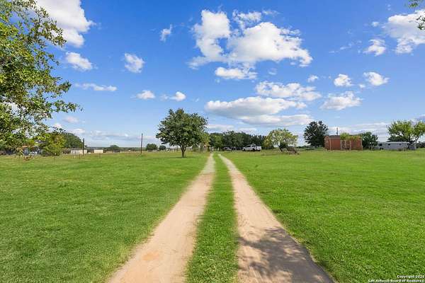 5 Acres of Residential Land with Home for Sale in Floresville, Texas