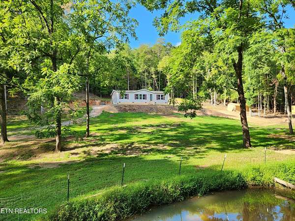 28.4 Acres of Land with Home for Sale in Vonore, Tennessee