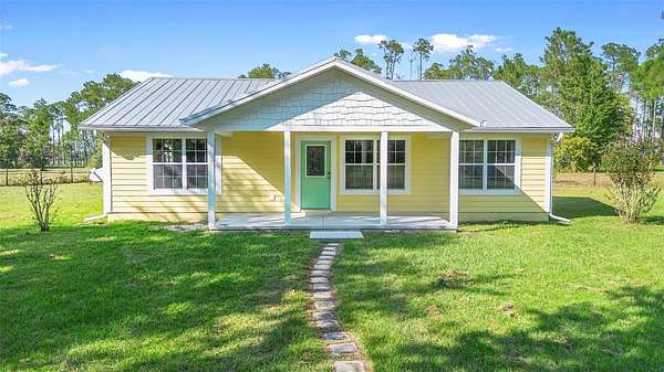 9.4 Acres of Land with Home for Sale in De Leon Springs, Florida