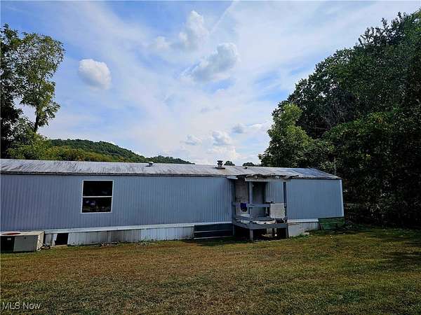 5.1 Acres of Residential Land with Home for Sale in Newcomerstown, Ohio