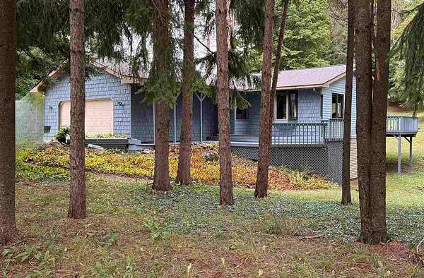 2.5 Acres of Residential Land with Home for Sale in Central Lake, Michigan