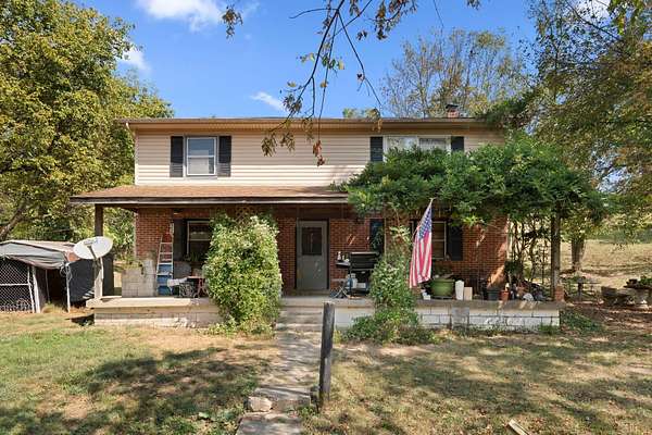 49.7 Acres of Land with Home for Sale in Versailles, Kentucky