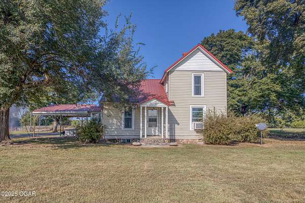 120 Acres of Agricultural Land with Home for Sale in Carthage, Missouri