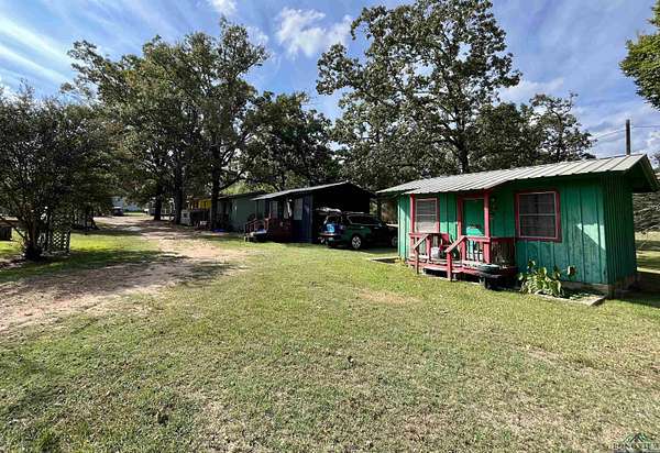 3.84 Acres of Residential Land with Home for Sale in Avinger, Texas