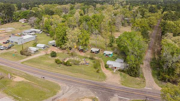 3.84 Acres of Land with Home for Sale in Avinger, Texas