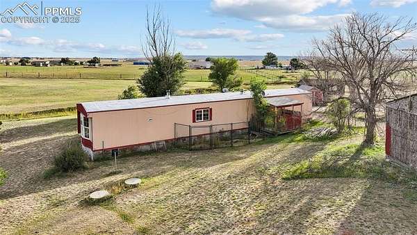 5 Acres of Residential Land with Home for Sale in Peyton, Colorado