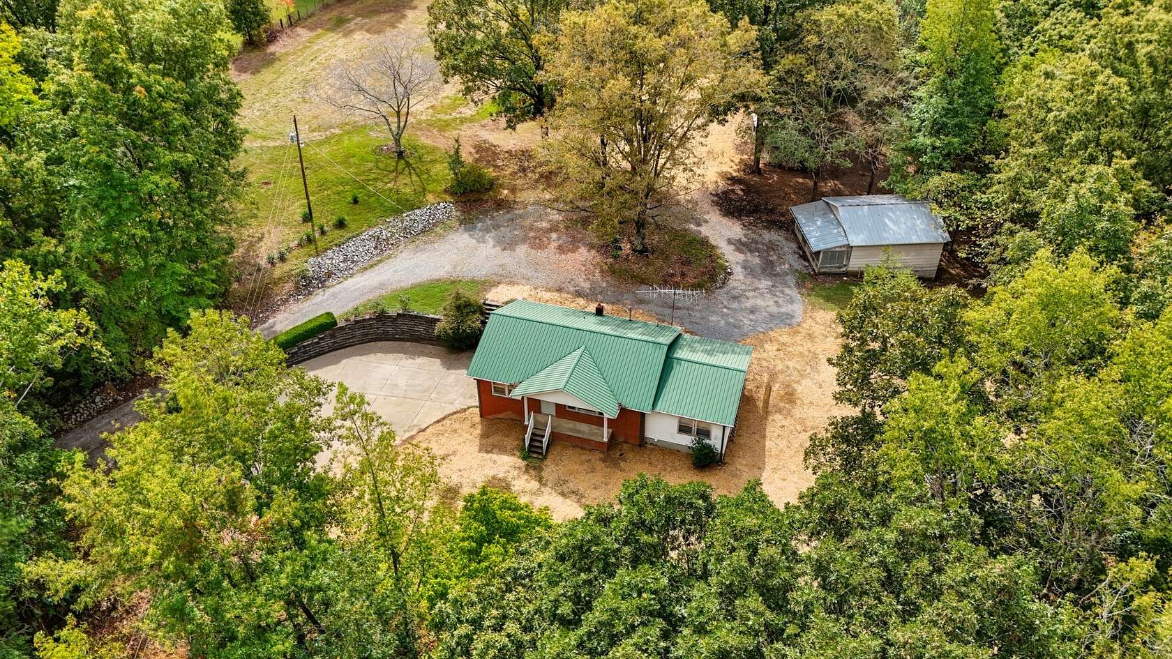 6.8 Acres of Residential Land with Home for Sale in McEwen, Tennessee