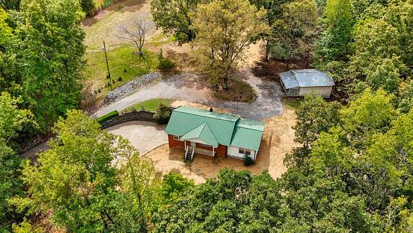 6.8 Acres of Residential Land with Home for Sale in McEwen, Tennessee