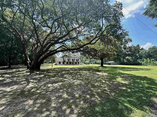5 Acres of Residential Land with Home for Sale in Pace, Florida