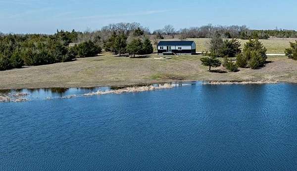 10.8 Acres of Land with Home for Sale in Roxton, Texas