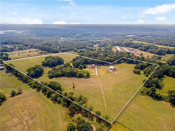 27 Acres of Agricultural Land with Home for Sale in Gravette, Arkansas